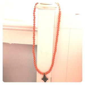 Akola Project beaded cross necklace in orange